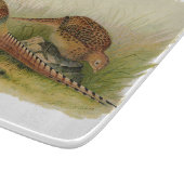 Ein Paar necked Fasane des Ringes auf einem Schneidebrett (Ecke)