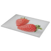 Ein Paar rote Erdbeeren Schneidebrett (Ecke)