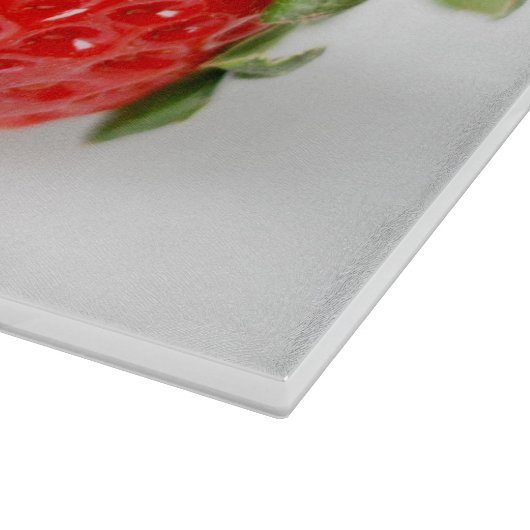 Ein Paar rote Erdbeeren Schneidebrett (Ecke)