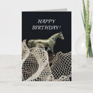 Ein Pferd in Goldmetall zum Geburtstag des Gewinne Karte