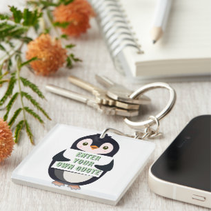 Ein Pinguin hält ein Schild mit anpassbarem Text t Schlüsselanhänger