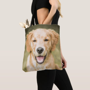 Ein Porträt eines golden retriever-Welpen Tasche