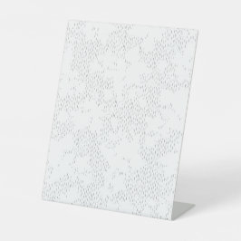 ein Rahmen aus schwarz-weißem Foto mit weißem Hint Sockelschild