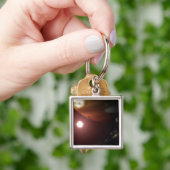 Ein riesiger Planet, der einen roten Zwergstar umk Schlüsselanhänger (Hand)