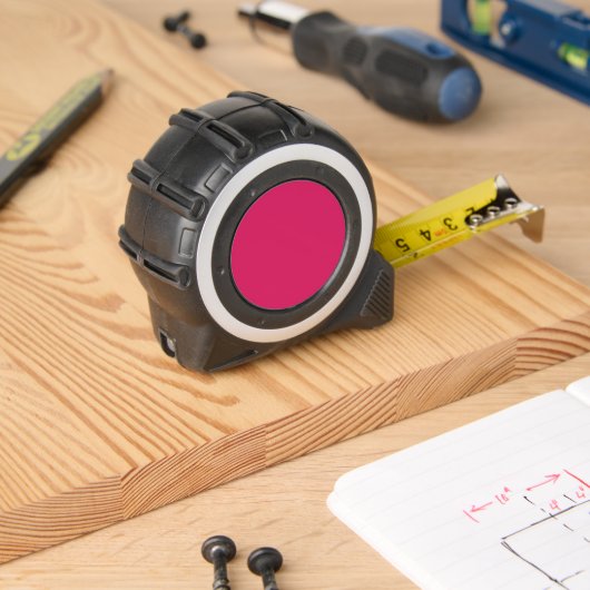 ein rosa Hintergrund mit weißem Rand Maßband (Holzbau)