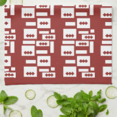 Ein roter Teppich mit einem textilen Muster wird a Geschirrtuch (Gefaltet)