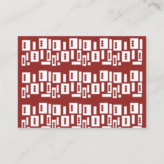 Ein roter Teppich mit einem textilen Muster wird a Platzkarte (Rückseite)