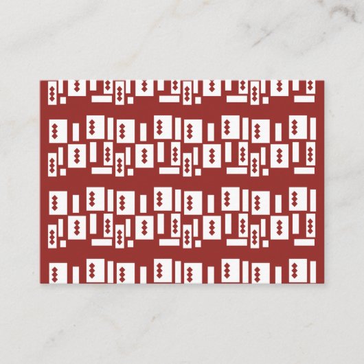 Ein roter Teppich mit einem textilen Muster wird a Platzkarte (Vorderseite)