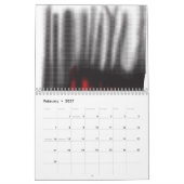 Ein rotes grafisches Design mit fett geometrischer Kalender (Feb 2027)