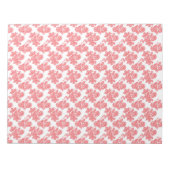 Ein rotes und weißes Blume-Muster auf einem weißen Notizblock (Vorderseite)