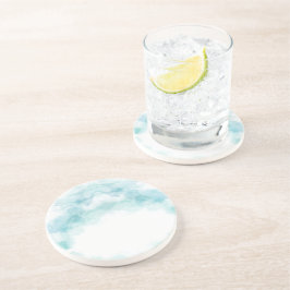 Ein rundes Keramiktablett mit einem blassblauen  Getränkeuntersetzer