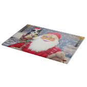 Ein Santa-Claus mit einer niedlichen Grenzkollie u Schneidebrett (Ecke)