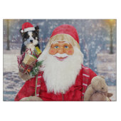 Ein Santa-Claus mit einer niedlichen Grenzkollie u Schneidebrett (Vorderseite)