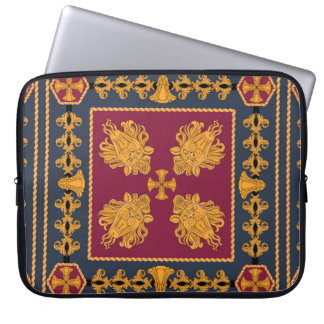 Ein Schal mit einem Muster aus goldenen Löwenköpfe Laptopschutzhülle