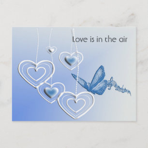 Ein Schmetterling und Herzen Postkarte