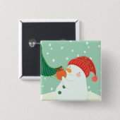 Ein Schneemann, der eine Verzierung auf einem Baum Button (Vorne & Hinten)
