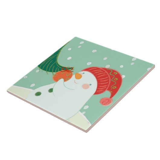 Ein Schneemann, der eine Verzierung auf einem Baum Fliese (Seite)