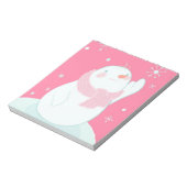 Ein Schneemann, der nach einer fallenden Schneeflo Notizblock (Rotiert)