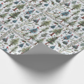 Ein Schneemann und Weihnachtsbäume in gepolstertem Geschenkpapier (Ecke)