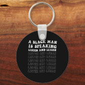 Ein Schwarzer hört zu und lernt ihn schwarz Schlüsselanhänger (Vorderseite)