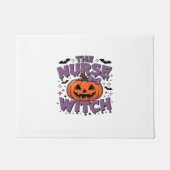 Ein spielerisches Design mit Kürbishexe und einem Fußmatte (Vorderseite)