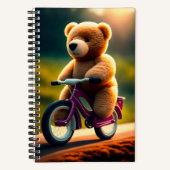 Ein Teddybär, der ein FahrradNotebook fährt Notizblock (Vorderseite)