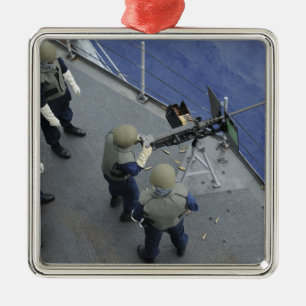 Ein US-Seeleute feuert einen 50-Kaliber M2HB Silbernes Ornament