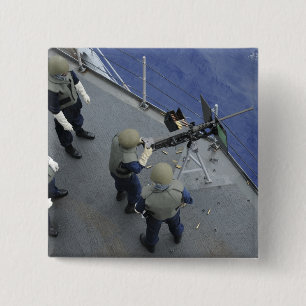 Ein US-Seemann feuert ein 50 Kaliber M2HB ab Button