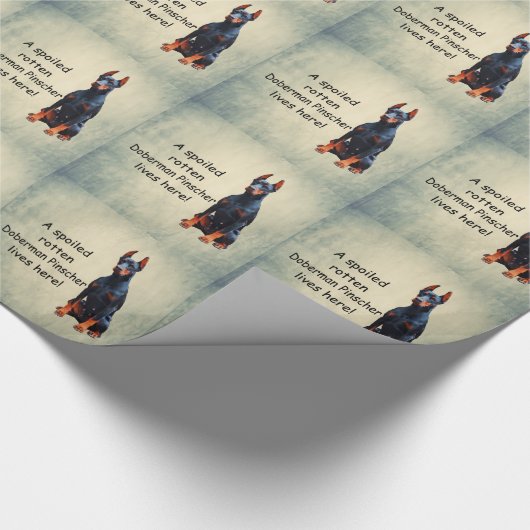 Ein verwöhnter Rotten Doberman Pinscher lebt hier Geschenkpapier (Ecke)