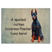 Ein verwöhnter Rotten Doberman Pinscher lebt hier Schneidebrett (Vorderseite)