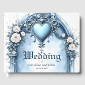 Ein verzierter, hellblauer Bogen mit Blumenakzente Gästebuch (Vorderseite)