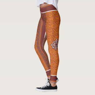 Ein visuell auffälliges Muster, das Orange und b k Leggings