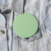 Ein weicher, blassgrüner Hintergrund füllt das Bil Button (Beispiel)