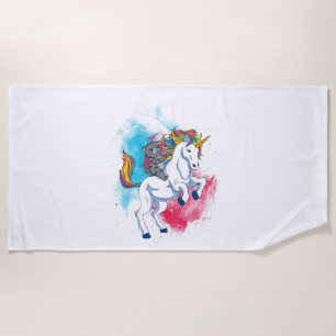 Ein weißes Einhorn mit Regenbogen-Schwanz, geritte Strandtuch