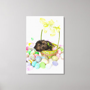 Ein Yorkie-poo Welpe, der einen Ostern-Korb Leinwanddruck