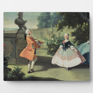 Ein Ziergarten mit einem jungen Mädchen, das zu Fotoplatte