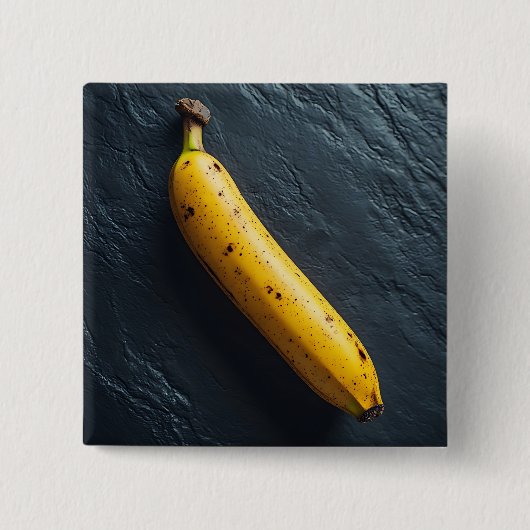 Eine Banane auf einer dunklen Oberfläche Button (Vorderseite)