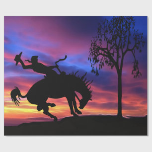 Eine Cowboy-Silhouette bei Sonnenuntergang Geschenkpapier
