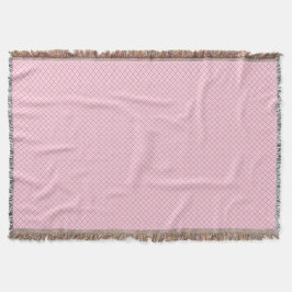 Eine dekorative rosa Wurfdecke mit einem subtilen  Decke