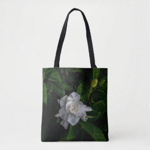Eine empfindliche weiße Blume blüht Tasche