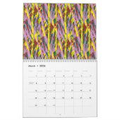 Eine flauschig graue Katze mit grünen Augen sitzt  Kalender (Mär 2026)