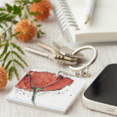 Eine geschlossene Blume auf einem weißen Schlüsselanhänger (Vorderseite rechts)