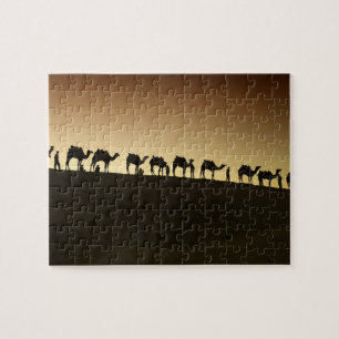 Eine Gruppe von Kamelhirten mit ihren Kamelen Puzzle