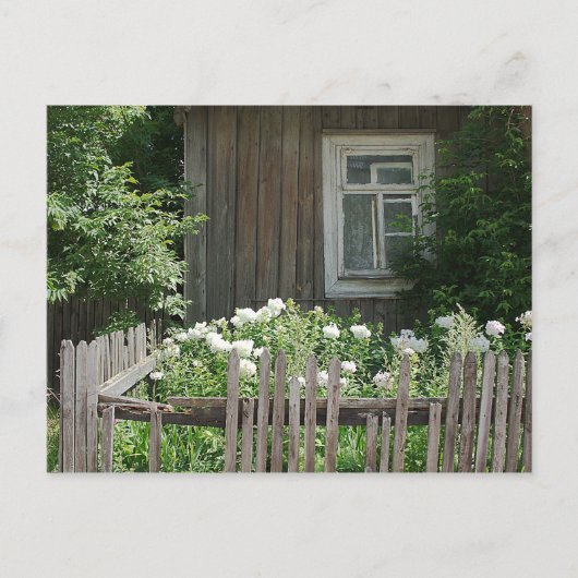 Eine Holzhütte mit Postkarte (Vorderseite)