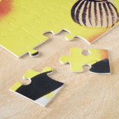 Eine Katze mit einem Fisch in seinem Mund, vom Puzzle (Seite)