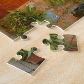 Eine Katze sucht Eintritt in die Zuhause in Pienza Puzzle (Seite)