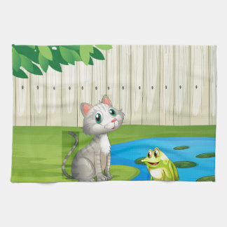 Eine Katze und ein Frosch innerhalb des Zauns Handtuch