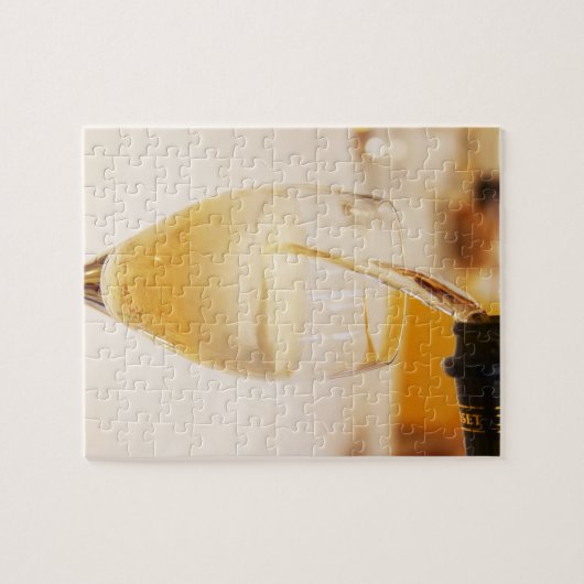 Eine mit Gosset gefüllte Champagnerflöte Puzzle (Horizontal)