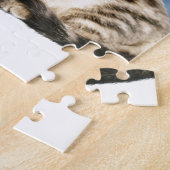 Eine Niedliche Katze, die einen Weihnachtsschnee i Puzzle (Seite)