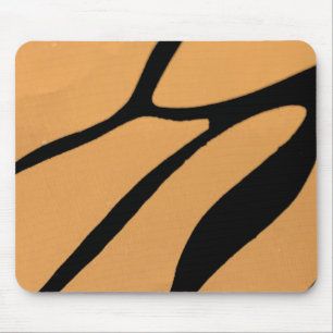 eine orangefarbene Oberfläche mit unregelmäßigen s Mousepad